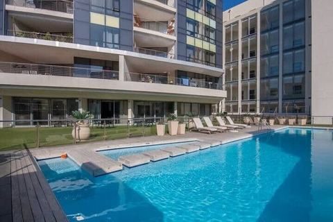 Skyline Serenity: Luxe City Living with Rooftop Oasis