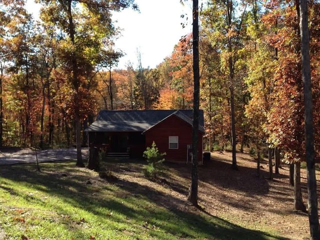 Gas fireplace, firepit, and cedar Adirondack chair — Spencer, TN