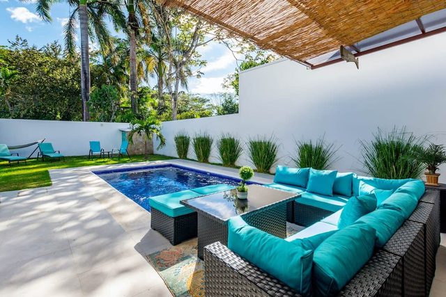 Ultramodern Townhome with an Inviting Coastal Design and Lush Outdoor Oasis with a Private Pool