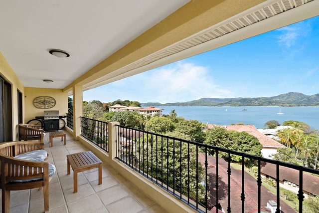 Remodeled Top-Floor Condo with Stunning Wrap-Around Balcony Offering Mountain, Ocean & Marina Views