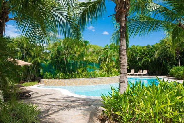 Colorful Poolside Condo w/ Garden-View Patio & Resort-Style Amenities