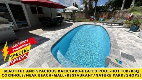 BEAUTIFUL AND SPACIOUS BACKYARD-HEATED POOL-HOT TUB/BBQ/CORNHOLE/NEAR BEACH/MALL