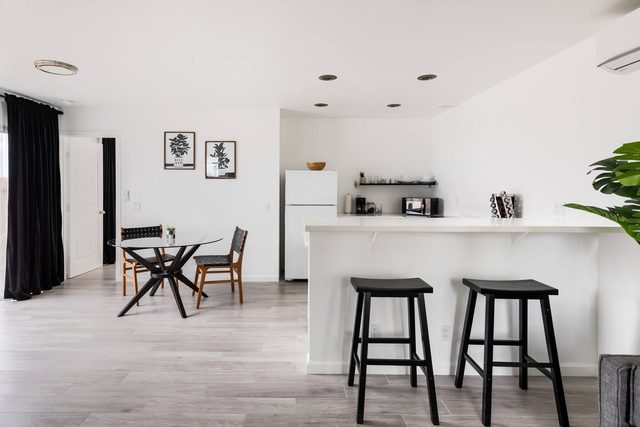 Striking Black & White Apt w Gated Entrance & Yard