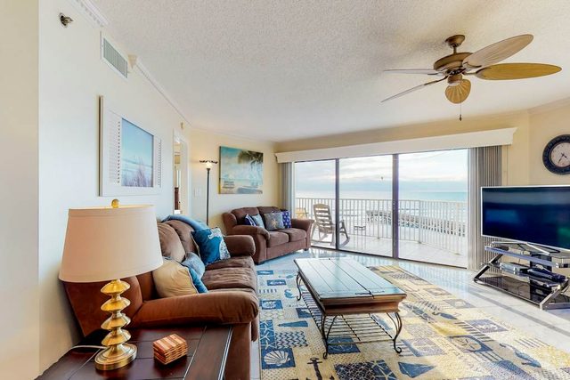 Sunny beachfront condo with pool access to beach attractions