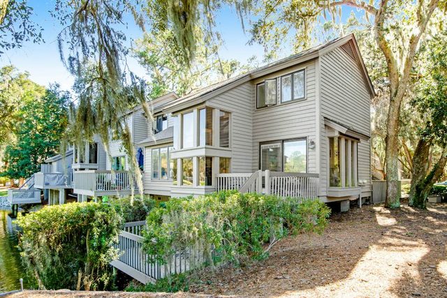 Nautical touches abound at this renovated waterfront condo with pool & tennis
