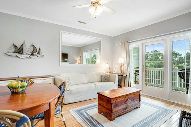 2nd-floor retreat with screened porch, shared pool, WiFi, central AC & elevator