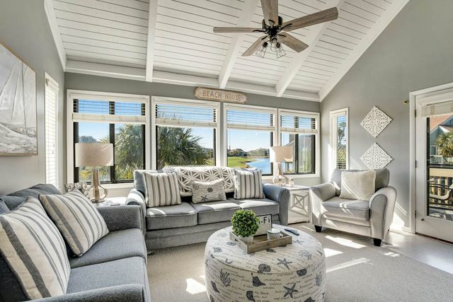 Stylish beach villa with three decks, and golf course views