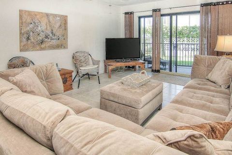 Elegant 1st floor condo w private patio AC on site outdoor pool and gas grills