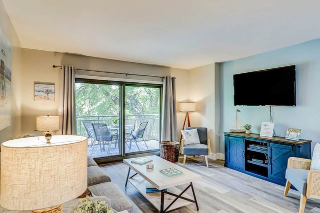 4th-floor villa with balcony, beach access, outdoor pool, & grills