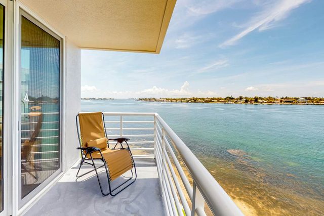 Water view condo with private beach pool and hot tub snowbird friendly