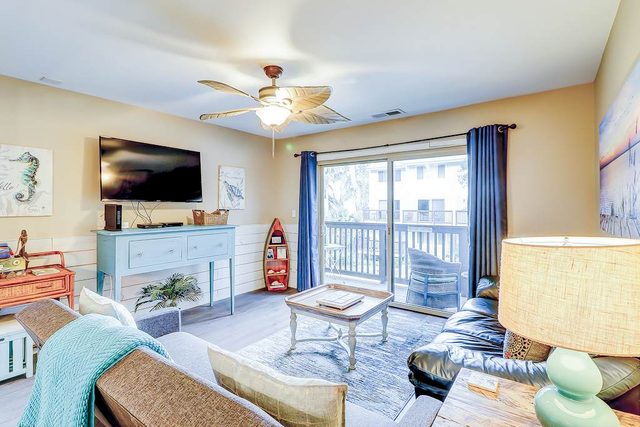 Chic beach condo with direct beach access, on-site pool, & private balcony