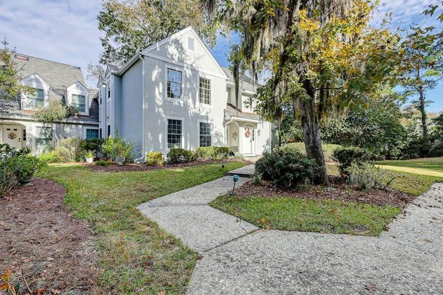 Coastal condo with private patio and lagoon view, golf, pool, tennis court & W/D