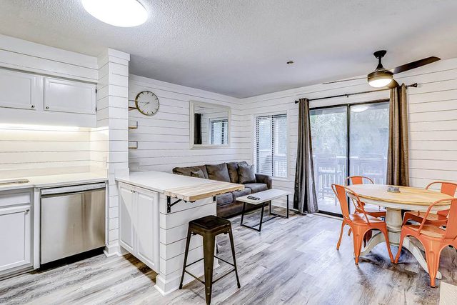 Modern condo with water views, central air-conditioning, shared pool, & hot tub