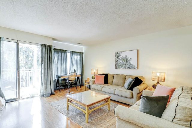 2nd-floor snowbird-friendly condo with balcony, pool, tennis, pool views, & W/D