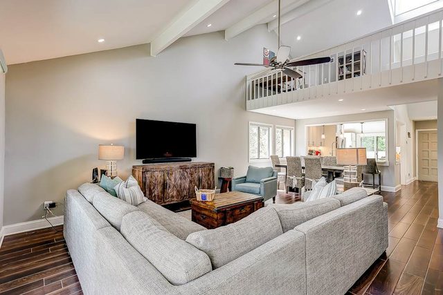 Golf course-front townhome near beach with two patios, balcony, & pool access