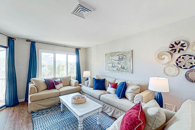 Lovely top floor villa in Wild Dunes with partial ocean views, pool, & W/D
