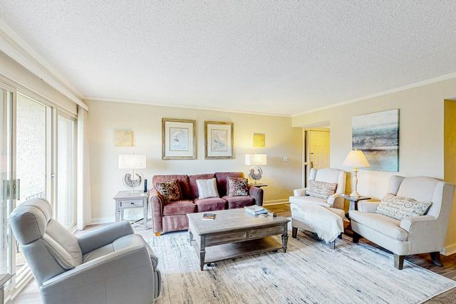 Bay-view condo with balcony, AC, & W/D - walk to beach