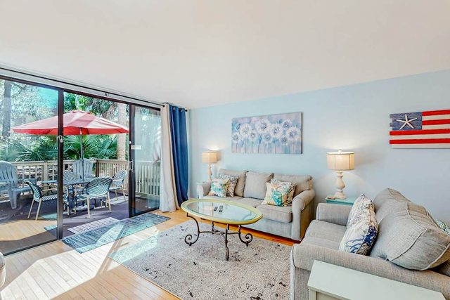 Beach access condo with deck, pool, washer/dryer, and AC - snowbird-friendly