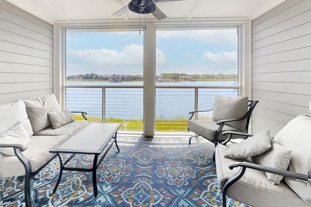 Newly renovated two-story waterfront condo with screened porch, pool, & tennis