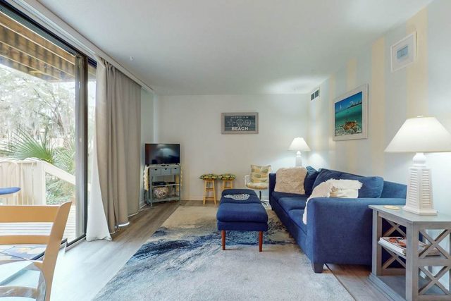Idyllic island getaway with pool, private patio, pond views, & easy beach access