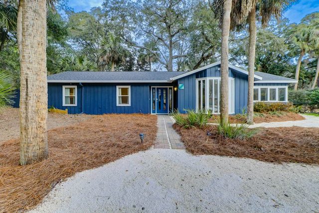 Palm-lined hideaway with pool, hammock, & spacious interior - dog-friendly