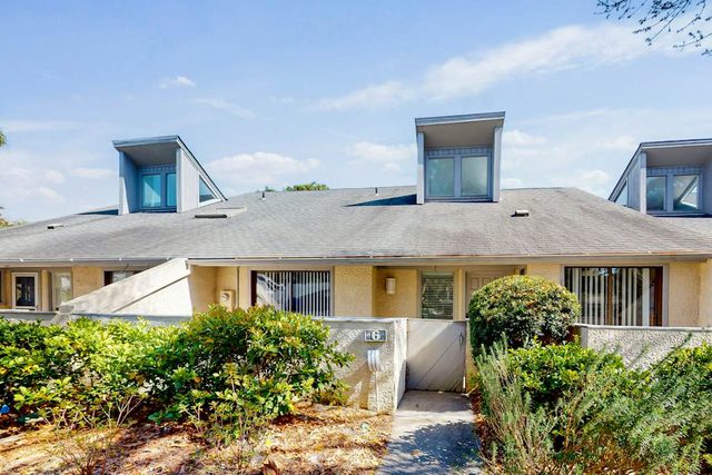 Water-view townhome with pool & tennis access & on-site golf