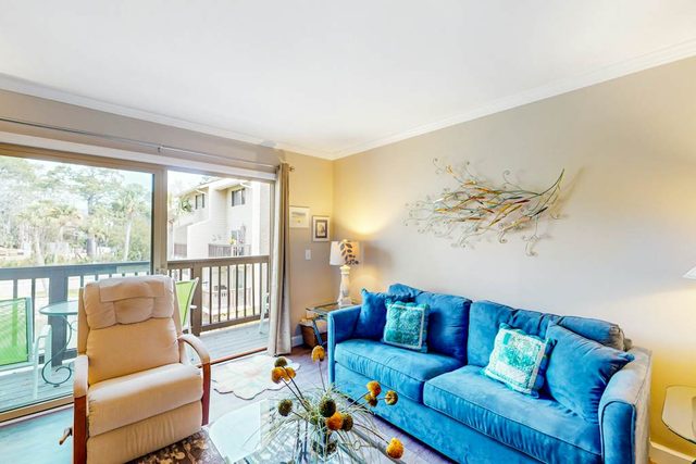 Fun & bright beach getaway with pool, easy beach access & pond view