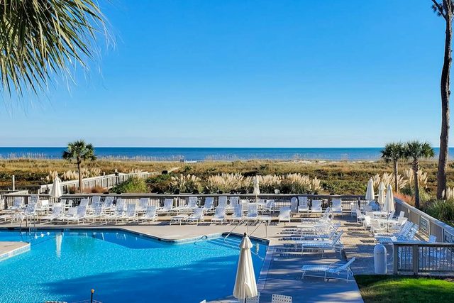 Updated oceanfront villa with amazing views, balcony, pool access & W/D