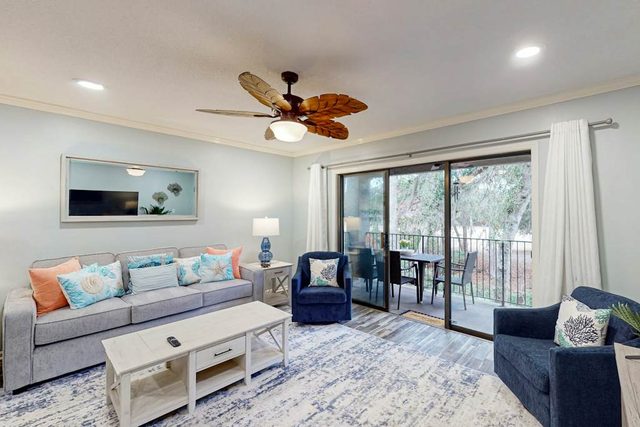Serene golf & lagoon view condo w/ pool access, office space, central AC & W/D