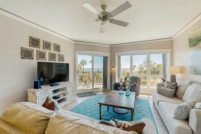 A spacious condo with community pool, hot tub, and oceanfront views