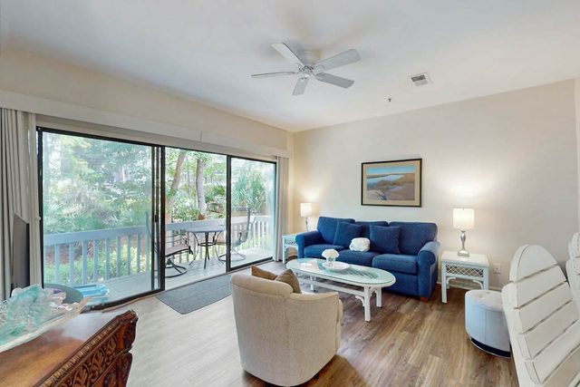 Open condo with pool, tennis, wooded balcony & central AC - close to the beach