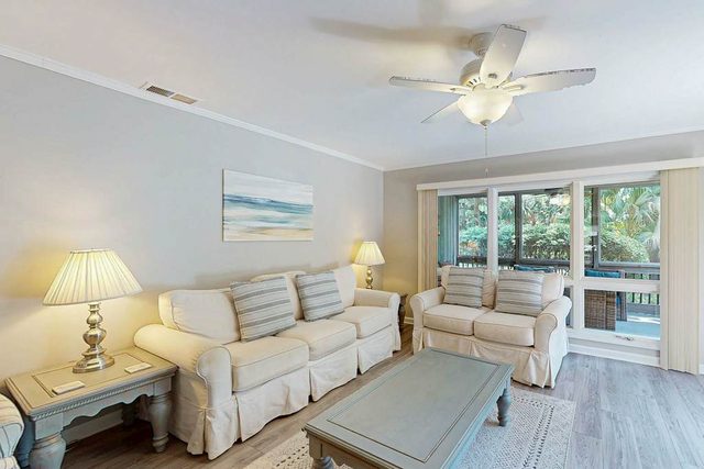 Updated all-suite tennis villa with W/D, pool, screened porch - near beach