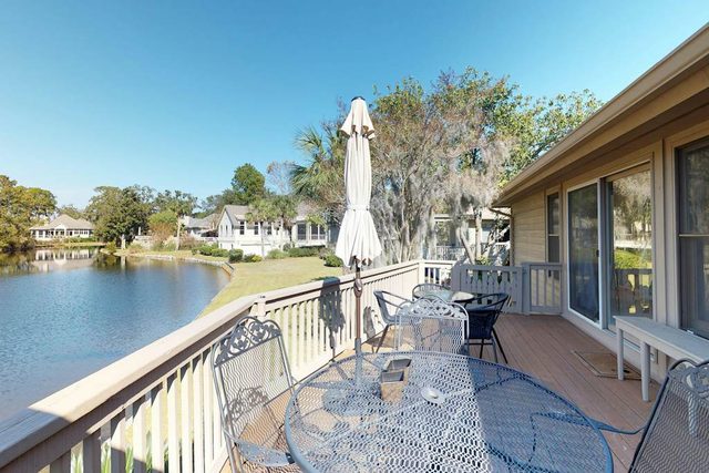 Dog-friendly home with shared pool, tennis, and basketball courts on-site.